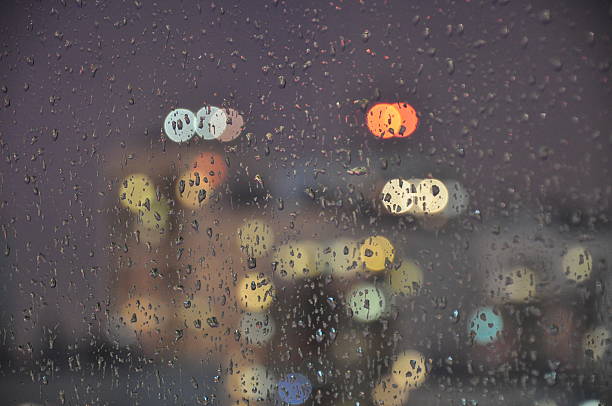 istock Evening City Lights Through A Wet Window 620966722