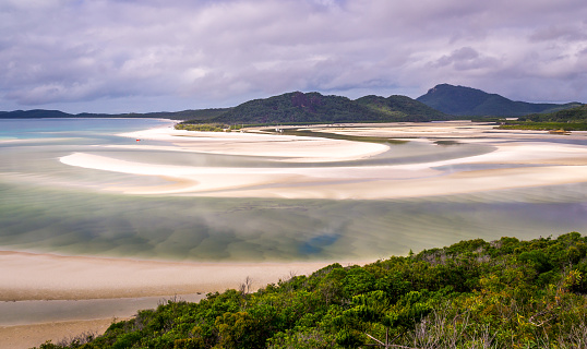 View from hill inlet lookout on Whitehaven beach at Whitsunday Island near Airlie Beach, Australia at low tide. The beautiful green color is very rare.