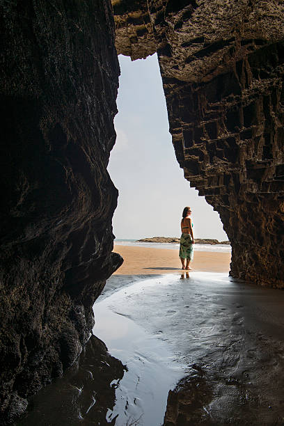 istock View through beach opening to contemplative woman 620969067