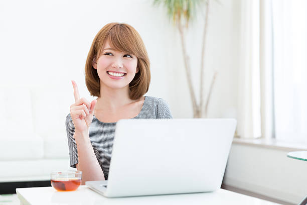 istock Japanese woman using a laptop 620974204