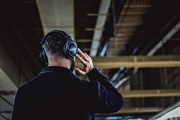 istock Hipster from the back listening music 620975678