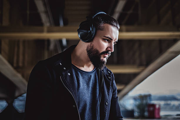 istock Hipster listening music outside 620975680