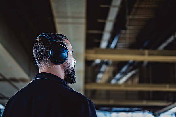 istock Hipster listening music under the bridge 620975706