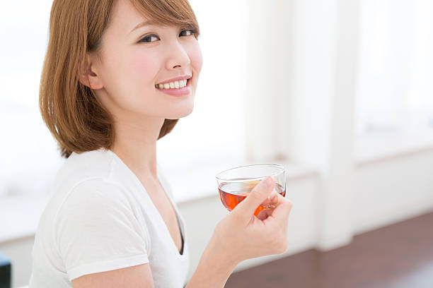istock Japanese woman having a cup of tea 620977844