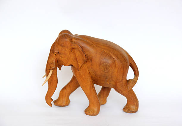 istock Wooden handmade elephant statue isolated on white 620979620