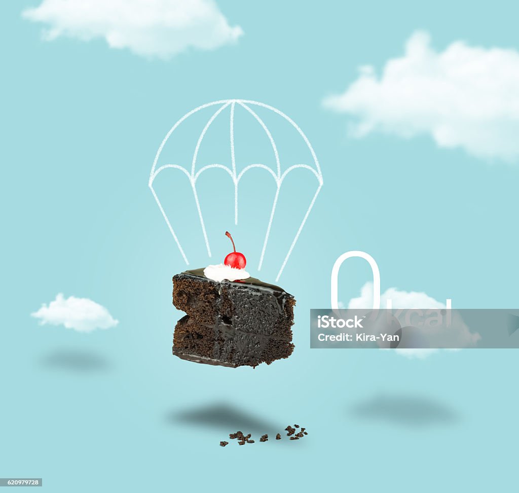 Isolated Chocolate cherry cake with parachute on blue sky background Isolated Chocolate cherry cake with parachute on blue sky background. Chocolate pie. Flying brownie with cream. Cloud - Sky Stock Photo