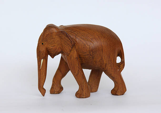 istock Wooden handmade elephant statue isolated on white 620980156