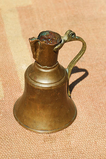 istock Ancient metal jug in oriental style 620982428