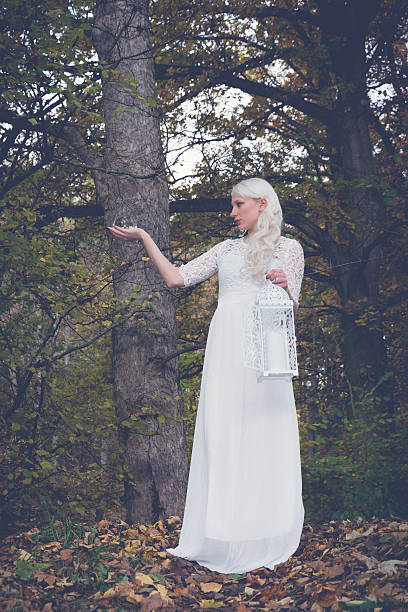 istock woman with lantern and glass ball 620983844