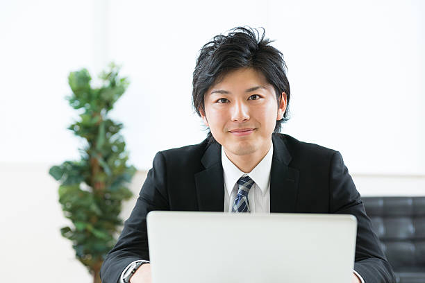 istock Japanese businessman using a laptop 620984540
