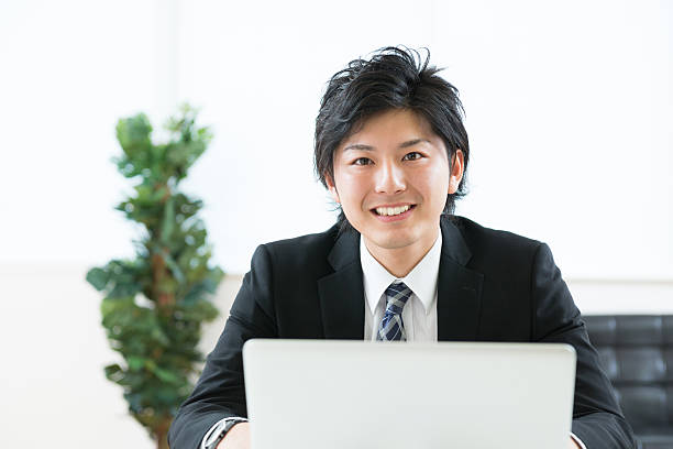istock Japanese businessman using a laptop 620984560