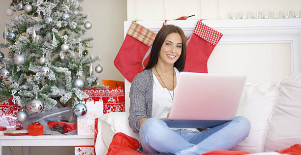 istock Relaxed young woman working on her laptop 620985166