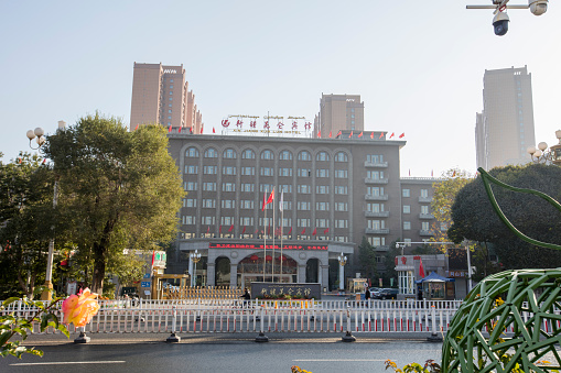 Urumqi, Xinjiang, China- October 10, 2016: Street view of Balou hotel at Urumqi. It is a famous building in Urumqi.