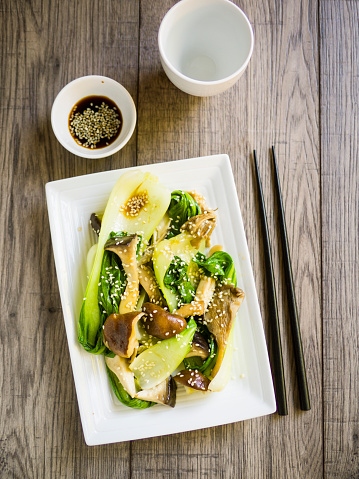 Home made freshness vegetarian food,stir-fried bok choy with wild mushroom and soy sauce and sesame seeds
