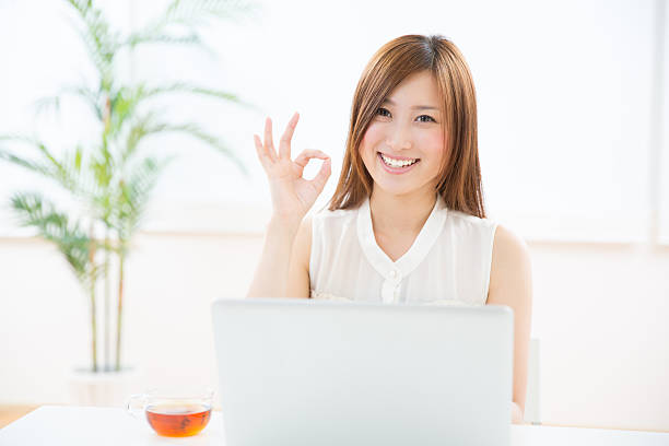 istock Japanese woman using a laptop 620989836