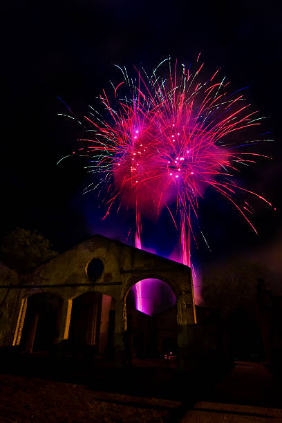 istock fires fireworks on the sky of the ancient ruins 620990890