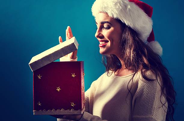 istock Happy young woman with Christmas present box 620991152