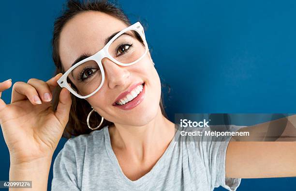 Young Woman Taking A Selfie Stock Photo - Download Image Now - Adult, Adults Only, Cheerful