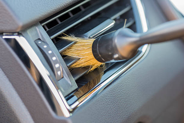 cleaning air grille. - car cleaning inside of indoors imagens e fotografias de stock