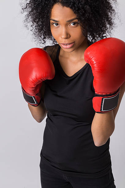 istock Cute African girl boxer in protection pose 620992080