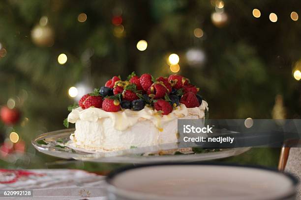 Pavlova With Berries And Passionfruit At Christmas Time Stock Photo - Download Image Now