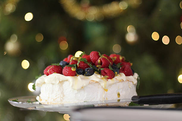 istock Close-up pavlova with defocussed Christmas Tree 620992234