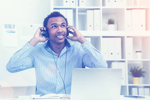 istock Man holding headphones, toned 620992828