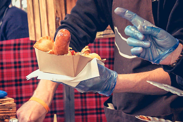 istock Male chef preparing hot dog 620996962
