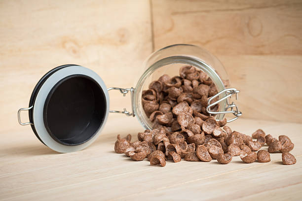istock Chocolate cereal cornflakes spilling to the wood surface 620997814