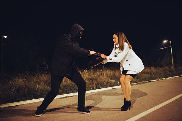 istock Robber stealing businesswoman bag 621100192