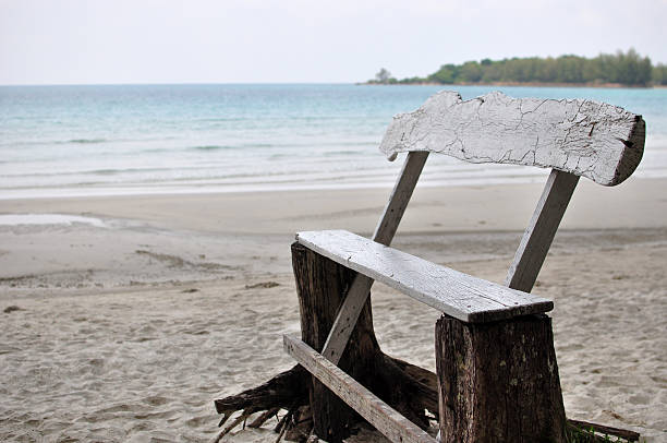 istock Wooden chair on the beach 621100518