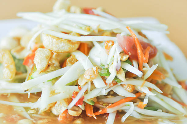istock spicy salad,Som Tam or Thai spicy salad 621100970