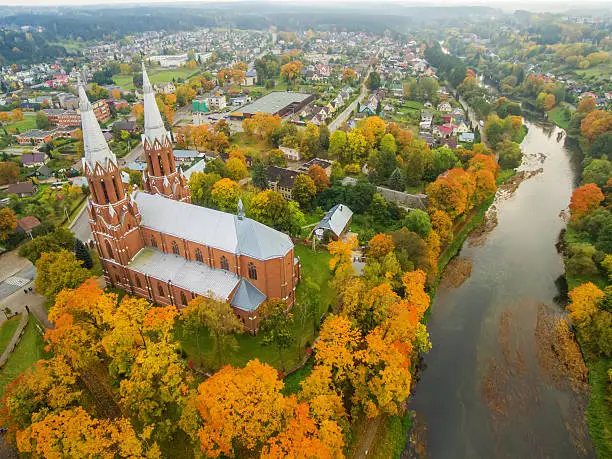 Anyksciai, Lithuania: aerial UAV top view of neo-gothic roman catholic church in the autumn