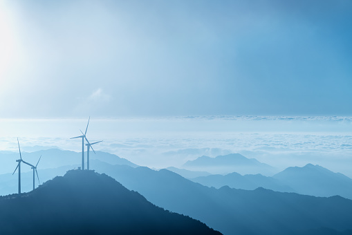 wind farm on the blue mountain top with beautiful nature landscape