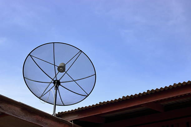 istock Satellite dish on the roof , blue sky background. 621103422