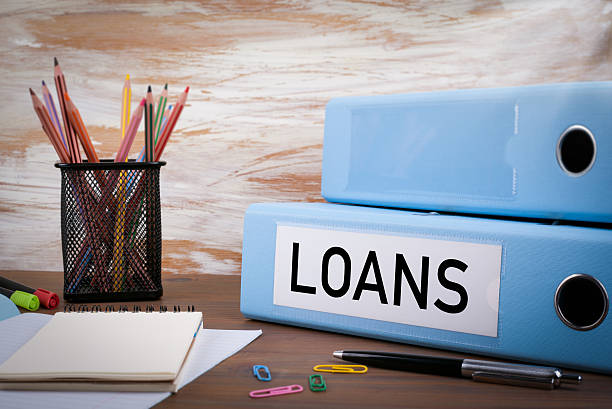istock Loans, Office Binder on Wooden Desk 621105810