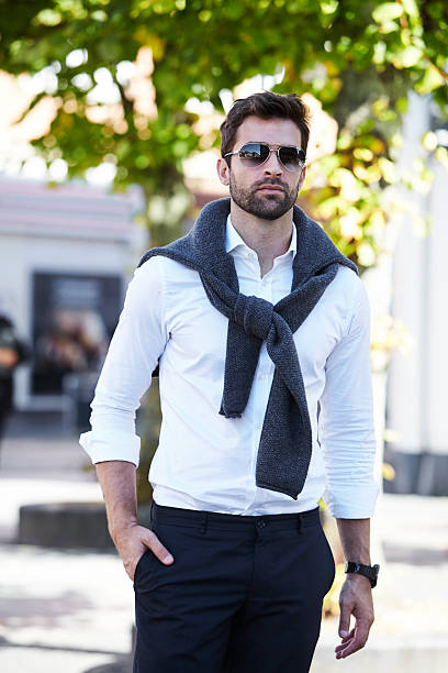 istock Dude in shirt and shades walking 621106018