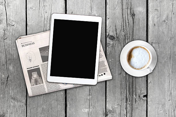 istock Daily newspaper, coffee and tablet with a blank screen. 621106028