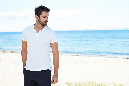 Dude on vacation standing on beach