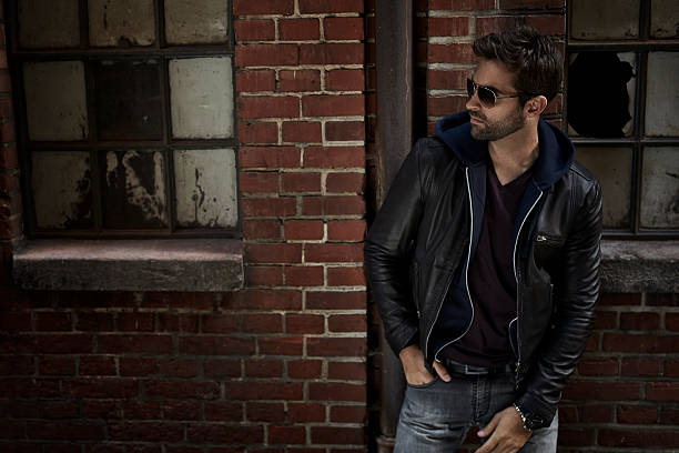 istock Jeans and jacket guy on street at night 621106340