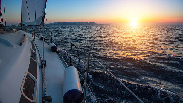 istock Sailing boat in the sea during a beautiful sunset. 621108188