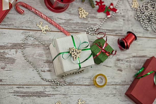 istock Wrapping modern Christmas gifts presents at home 621108810