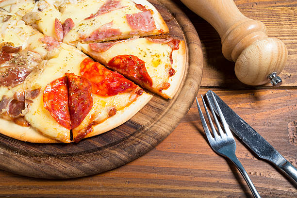 istock Pizza toping with cheese ham pepperoni and mushroom 621109054