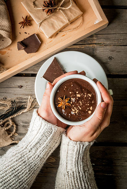 istock Girl drinks hot chocolate mug, with christmas present 621111042