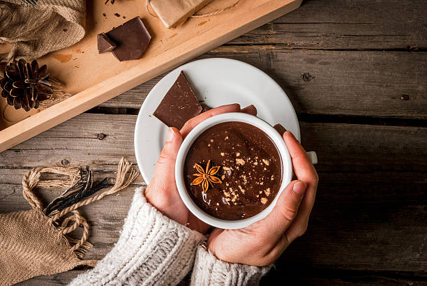 Girl drinks hot chocolate mug, with christmas present
