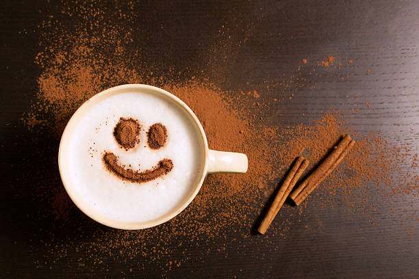 istock Cup of coffee with smile pattern of cinnamon 621112394