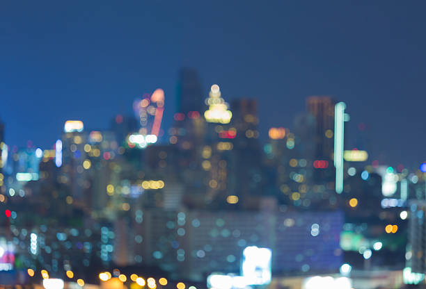 istock Abstract blurred bokeh lights night view, city office building downtown 621113974