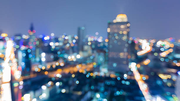 istock Blurred light night view city downtown abstract background 621114136
