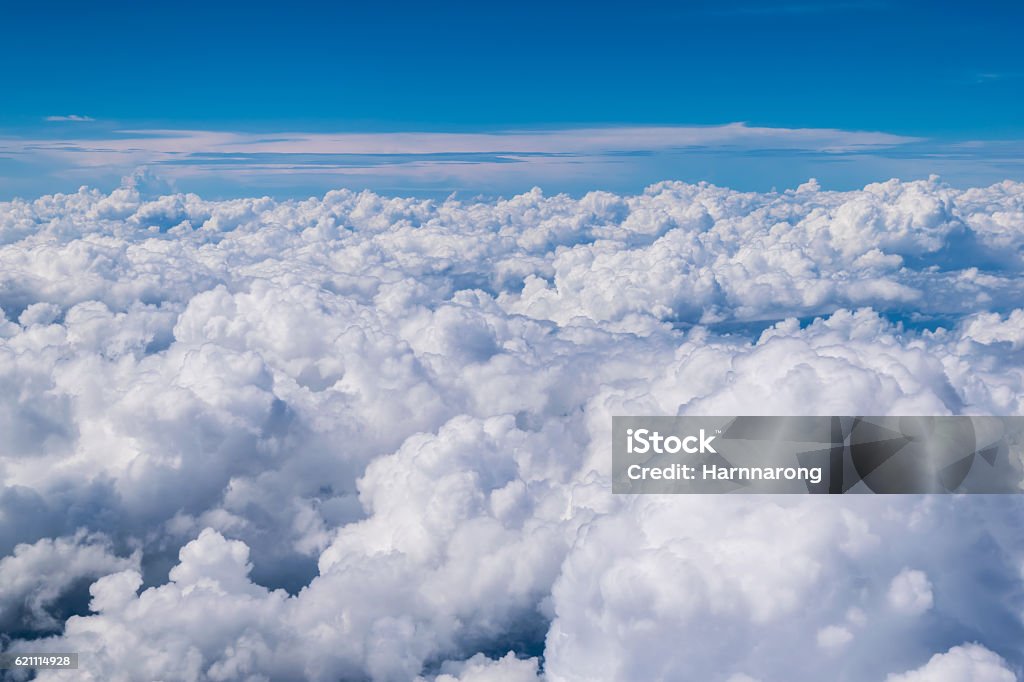 cloud above the blue sky This picture take from window of air plane in thailand Cloud - Sky Stock Photo