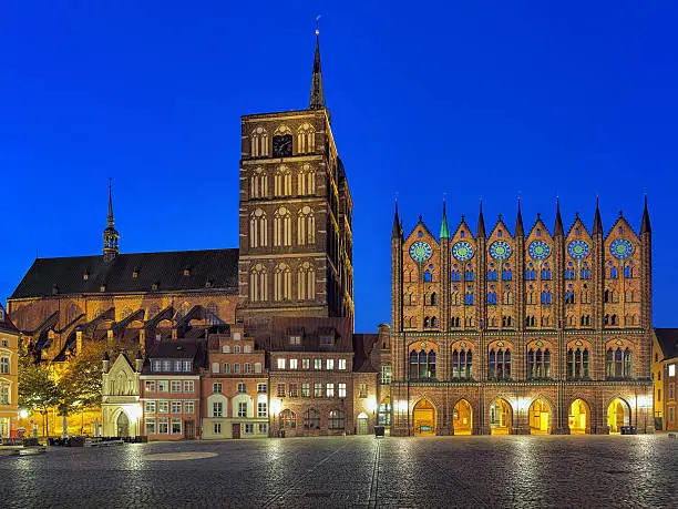 Stralsund, Germany. Night view of Old Market square with Nicholas' Church and City Hall in brick gothic style.
